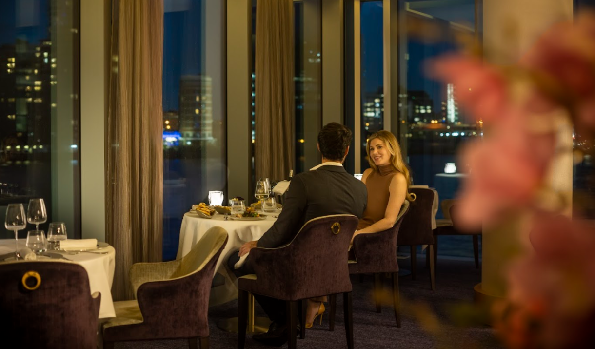 A couple enjoy dinner at Kinaara at the InterContinental London - The O2 on Greenwich Peninsula